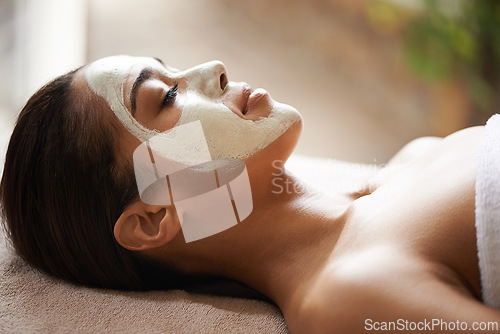 Image of Skincare, wellness and woman with face mask at spa for glow, natural and beauty routine with peace. Cosmetic, pamper and female person relaxing for clay facial dermatology treatment at salon.