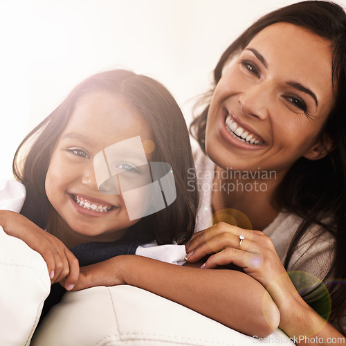 Image of Happy mom, portrait and child on sofa for love, bonding or care with lens flare at home. Face of mother, parent or little girl, daughter or kid with smile in living room for family weekend or support