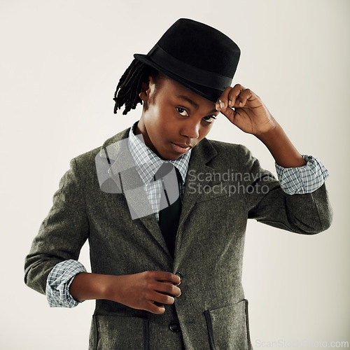 Image of Kids, fashion and boy portrait with hat in studio for stylish, cool or trendy outfit choice on grey background. Children, face and African model with elegant, style or cap for gentleman hello gesture