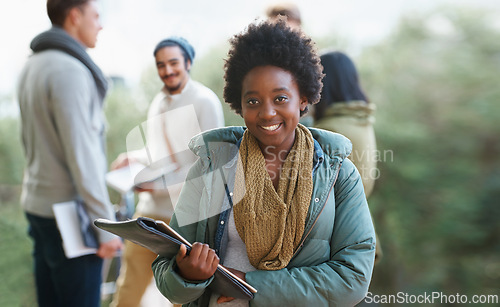 Image of Black woman, portrait and student outdoor with books for studying, learning and education for academic growth. Knowledge, scholarship and degree with smile on campus, college with textbook or folder