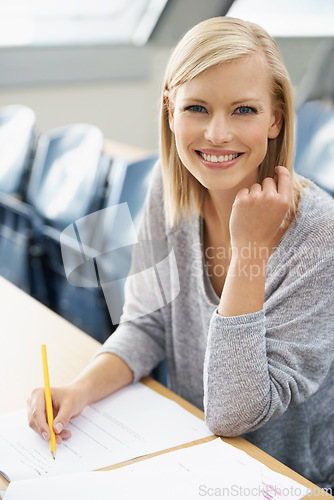 Image of Portrait, university or happy woman in classroom for knowledge, school development or notes. Scholarship, education or proud student with paper or smile for studying or learning in college campus