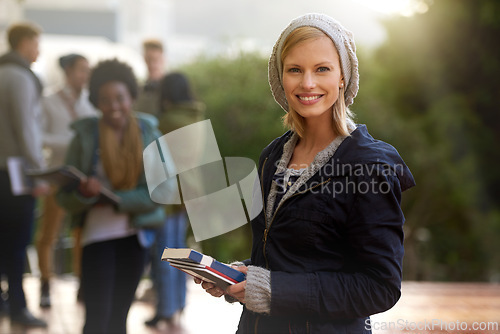 Image of Woman, portrait and student outdoor with books for studying, learning and education for academic growth. Knowledge, scholarship and degree with smile on campus, college with textbook or folder