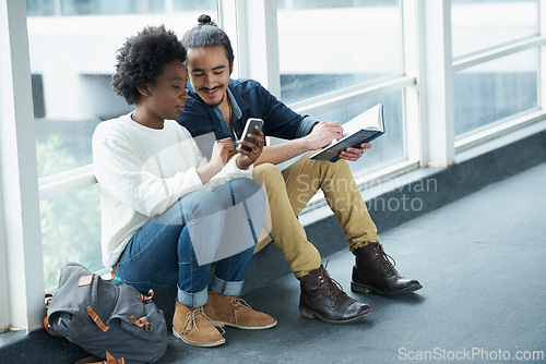 Image of Phone, happy and interracial couple of students on a campus with social media and university with smile. School, studying and diversity with mobile for streaming for education and college on the web