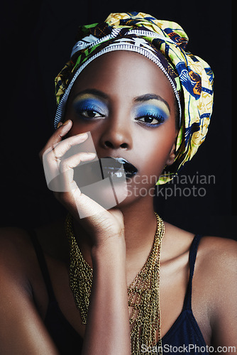 Image of Black woman, wrap and portrait with fashion, makeup and beauty in studio. Cosmetics, trendy and art with African female person from Kenya with traditional head scarf accessory with dark background