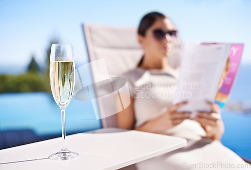 Image of Relax, pool and woman with champagne, magazine and reading in lounge chair on business trip. Travel, hospitality and businesswoman on deck with wine, book and sunshine holiday at luxury villa hotel