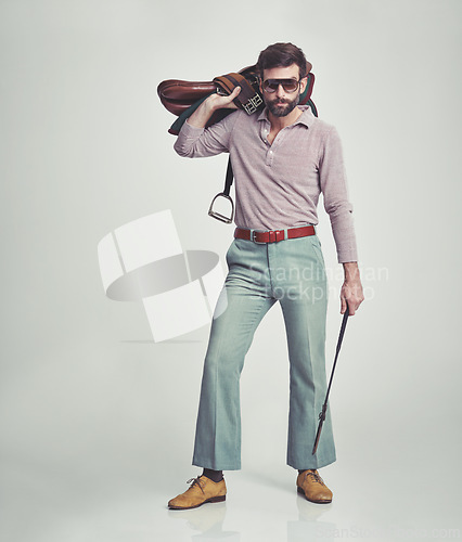 Image of Vintage, man and saddle with riding crop in studio for hobby, leisure and confidence with sunglasses. Equestrian, person and 70s style, hipster clothes or retro outfit for fashion on white background