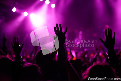 Image of Hands, crowd and silhouette at music festival with dancing for rock party at concert with stage lights, nightclub or dj. People, dance floor and holiday event in summer for entertainment, dark or fun