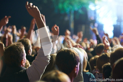 Image of Hands, people and music festival with dancing for party at concert with stage lights, nightclub or dj. Crowd, nature and entertainment for holiday techno in summer for new years, adventure or rave