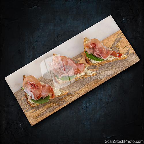 Image of Prosciutto bruschetta with fresh ingredients