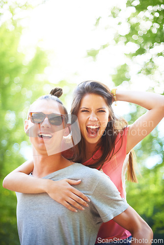 Image of Portrait, piggyback and happy couple in a park with fun, freedom and celebration outdoor. Energy, love or face of excited people in forest for weekend, holiday or vacation, bonding in nature together