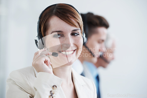 Image of Woman, callcenter and phone call, communication and contact us with headset and mic, coworking and smile. Telecom, customer service or telemarketing, agent with CRM for tech support or help desk