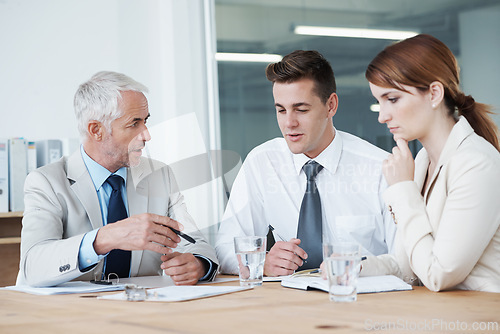 Image of Meeting, planning or training with manager and team in boardroom of office for coaching seminar. Collaboration, strategy or upskill development with business man teaching employee group at workplace