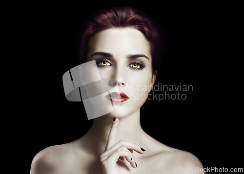 Image of Vampire, woman and gothic makeup in studio for beauty, cosmetics and dark aesthetic with thinking or scary face. Portrait of villain character, fantasy cosplay and contact lens on a black background