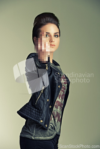 Image of Model, studio and punk with gesture, fashion and rebel for expression, anger and style. Woman, leather jacket and middle finger for attitude, confidence and individuality with portrait and rock star