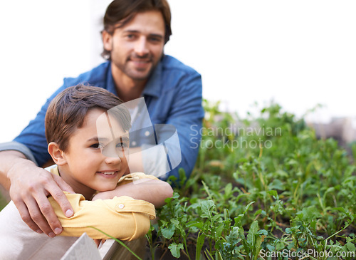 Image of Dad, son and portrait in garden standing by herbs bed, smiling and outdoors together for growth season. Parent, child and nurture agriculture for sustainability, environment and eco friendly