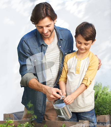 Image of Dad, boy and greenhouse with water for plants, vegetation and agriculture for family business. Father, son and teach in planthouse to grow organic vegetables to sell, sustainability and gardening