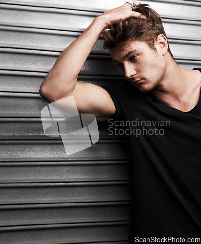 Image of Fashion, style and thinking with man on metal background for student, trendy and casual. Cool, mockup and handsome with young male person in urban outdoors for edgy, idea and stylish clothes