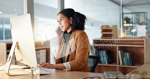 Image of Woman, computer and phone call as receptionist for client consulting or online booking, information with smile. Female worker, communication or talking in office for service, helping or appointment