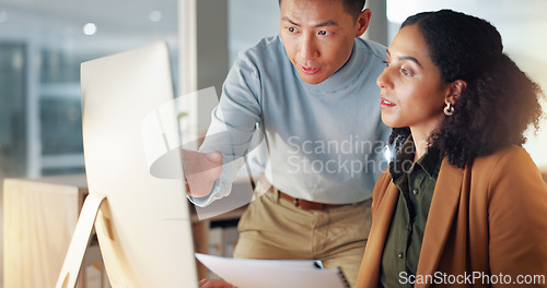 Image of Business people, documents and coaching in schedule planning, project or strategy together at office. Man giving paperwork to woman for review, plan or tasks on computer in team research at workplace