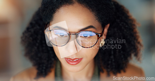 Image of Business woman, reading and research on computer for online project, article review and editing or night analysis. Happy african editor or journalist with screen in glasses reflection for news report