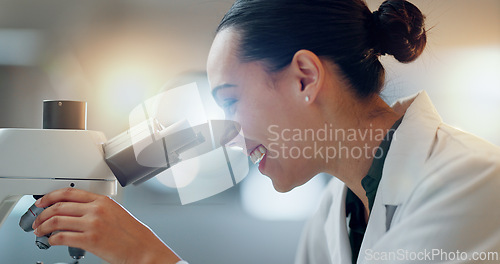 Image of Science, research and happy woman with microscope, technology or biotech data in laboratory. Medical innovation, scientist or lab technician in study in healthcare, medicine or pharmaceutical future