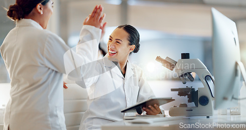 Image of Teamwork, scientist or doctors high five for success, medicine breakthrough or partnership in lab. Science, collaboration or happy women celebrate medical support, goal target or DNA news with smile