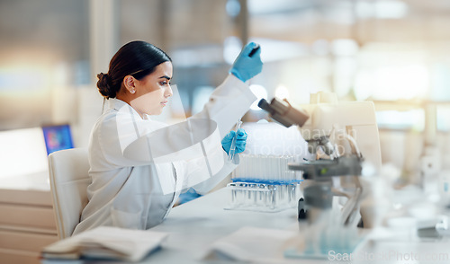 Image of Science, laboratory and woman with pipette, test tube and biotech solution in research. Medical innovation, scientist or lab technician in study for healthcare, medicine and vaccine results feedback.