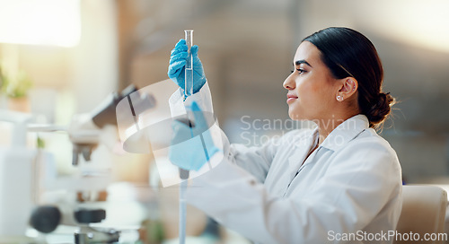 Image of Science, laboratory and woman with pipette, test tube and biotech solution in research. Medical innovation, scientist or lab technician in study for healthcare, medicine and vaccine results feedback.