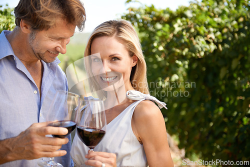 Image of Woman, portrait and man in vineyard for wine tasting, nature and smile for honeymoon trip for alcohol. People, happiness and standing in farm for agriculture with fruit and love for marriage