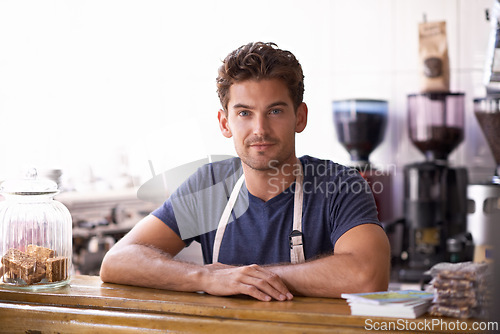 Image of Man, barista and portrait in coffee shop, counter and working in restaurant or small business. Male person, entrepreneur and professional in bistro, confidence and pride in career and hospitality