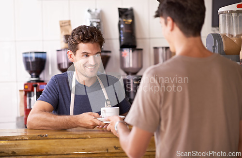 Image of Man, barista and cup in coffee shop, serving customer and working in restaurant or small business. Male person, entrepreneur and caffeine expertise in bistro, confidence and friendly in hospitality