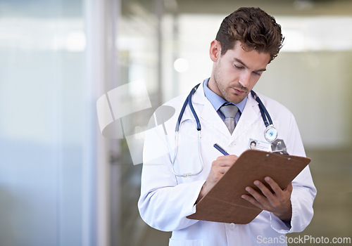 Image of Writing, clipboard and doctor in hospital for medical research information for diagnosis or treatment. Checklist, professional and male healthcare worker with documents or notes in medicare clinic.