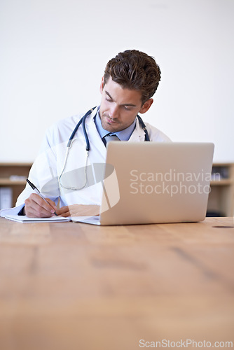 Image of Doctor, laptop and notebook for writing at desk for medical research, schedule or patient report in office. Man, technology and pen on paper for results, planning or health insurance in hospital