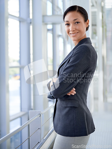 Image of Portrait of businesswoman, arms crossed or finance career in office for professional job or corporate company. Face, proud employee or work as financial consultant or happy female worker in workplace