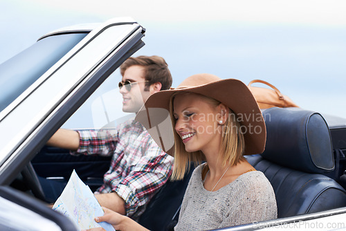 Image of Map, driving and couple in a car for travel to vacation, adventure or holiday destination. Happy, navigation guide and young man and woman on journey in vehicle for weekend road trip together.