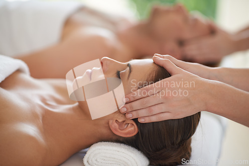 Image of Massage, head and couple in spa to relax with luxury treatment for wellness on holiday or vacation. Beauty, care and calm people together in hotel, salon or resort for healthy facial or skincare