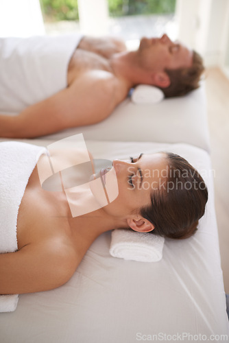 Image of Couple, together and relax in luxury spa for treatment on holiday or vacation with wellness. Beauty, care and calm people from above on table in hotel, salon or resort for skincare or cosmetics