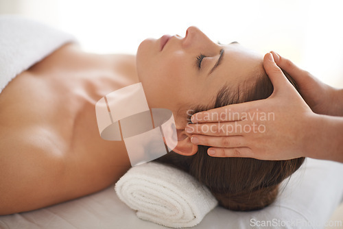 Image of Hands, head massage and woman at salon to relax, wellness and calm at luxury resort for therapy with masseuse for health. Closeup, face and person at spa for facial treatment, skincare and beauty