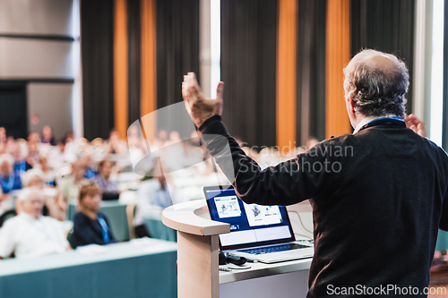 Image of Speaker at Business Conference and Presentation.