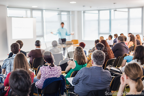 Image of Speaker giving presentation on business conference.