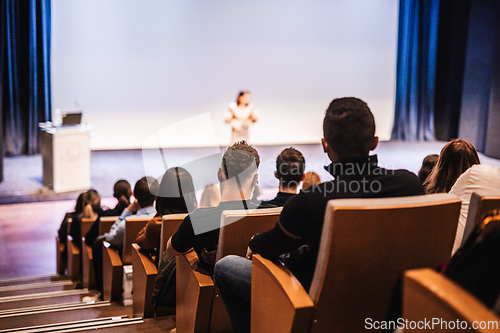 Image of Woman giving presentation on business conference event.