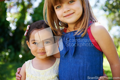 Image of Portrait, children and smile for play date in garden, park or forest on sunny day in New Zealand. Happy, girls or adopted sisters for hug in friend diversity or family photo in Spring or summer