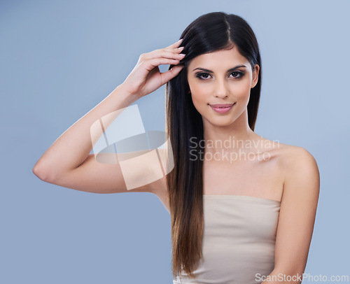 Image of Beauty, confident and woman with makeup in studio for health, wellness and salon treatment. Hair care, cosmetic and portrait of person with facial and hairstyle routine by blue background with mockup