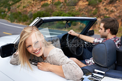 Image of Couple, convertible and driving on road or travel in California or adventure journey, summer or vacation. Man, woman and environment on mountain or relaxing trip with transport, weekend or happy