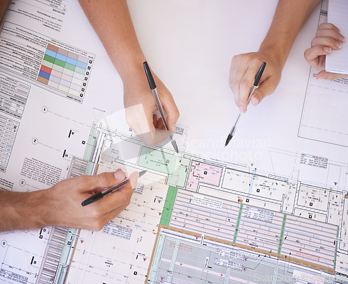 Image of Architecture, hands and team in office with floor plan, strategy and project management meeting. Engineering, blueprint and people problem solving together in collaboration for remodeling from above