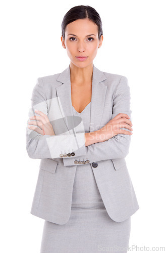 Image of Portrait, serious and business woman with arms crossed in studio isolated on a white background. Confidence, professional agent or entrepreneur with pride for career, job or employee working in Spain