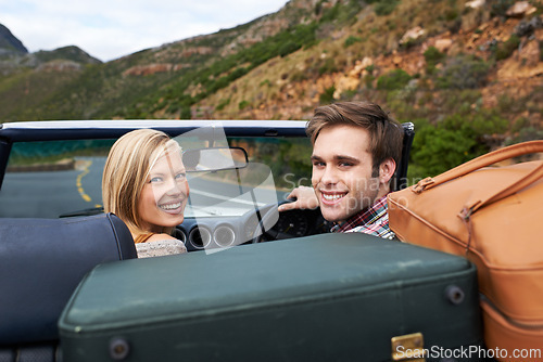 Image of Suitcases, driving and portrait of couple in a car for travel to vacation, adventure or holiday destination. Happy, love and young man and woman on journey in vehicle for weekend road trip together.