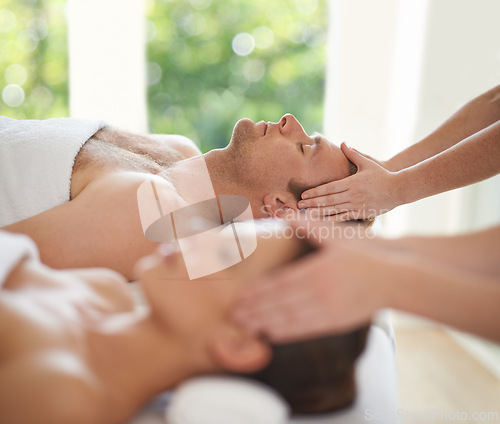 Image of Head, massage and couple in spa to relax with luxury treatment for wellness on holiday or vacation. Beauty, care and calm people together in hotel, salon or resort for healthy facial or skincare