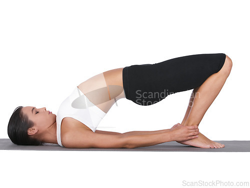 Image of Woman, yoga and stretching body for pilates, exercise or training in workout on a white studio background. Calm female person or yogi in warm up, balance or pose for zen or fitness on mockup space