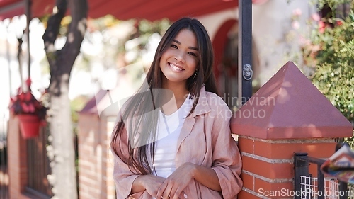 Image of Young Woman Enjoying Sunny Day in Spanish Town